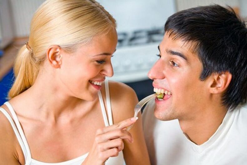 the woman feeds male products to stimulate potency